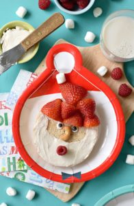 Brighten up your kids' Christmas morning with these gluten free Santa Bagels. Smothered with dairy free cream cheese and fresh fruit, this is one breakfast that is guaranteed to be on the Nice list this year.